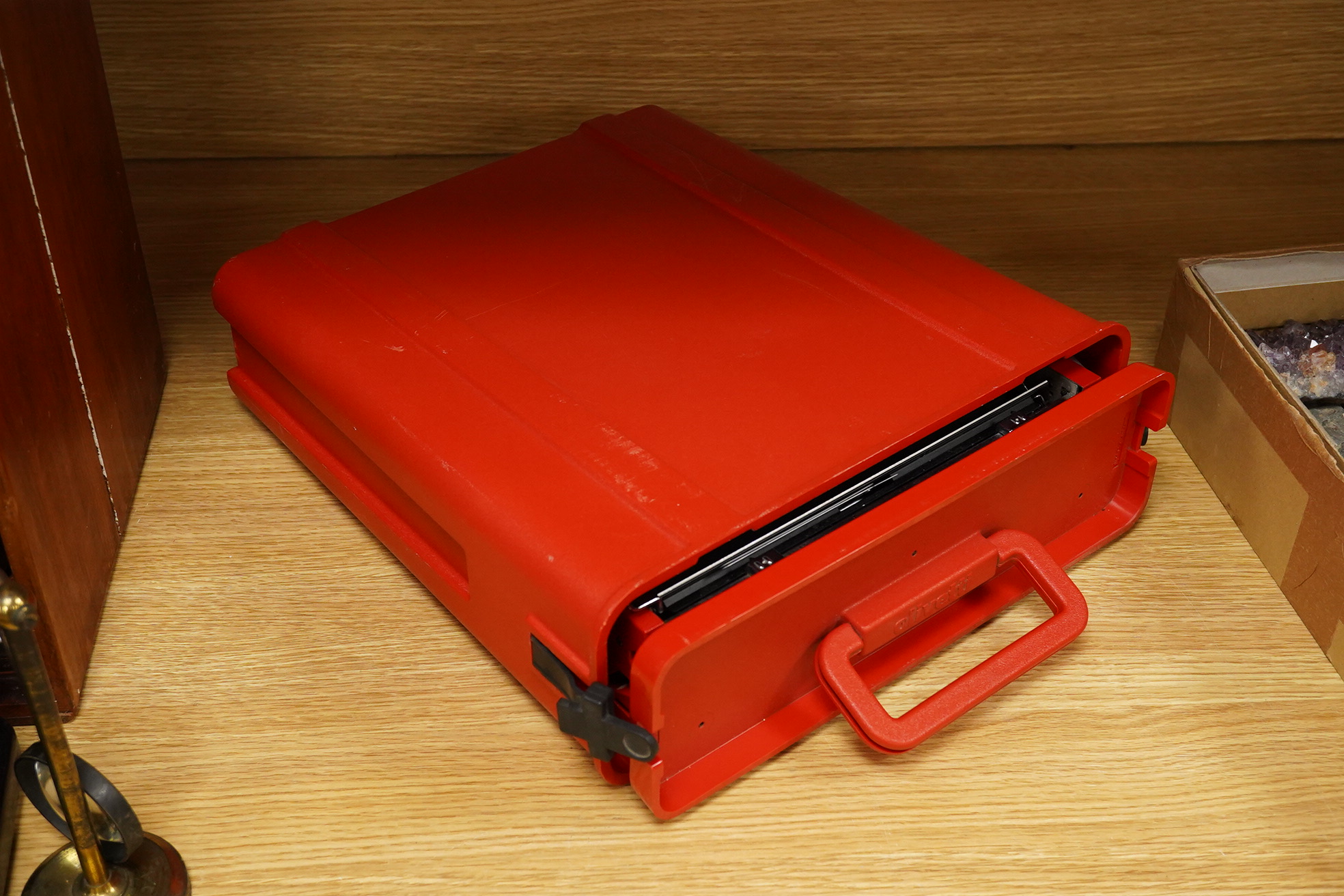 An Olivetti Valentine typewriter in red with tool case